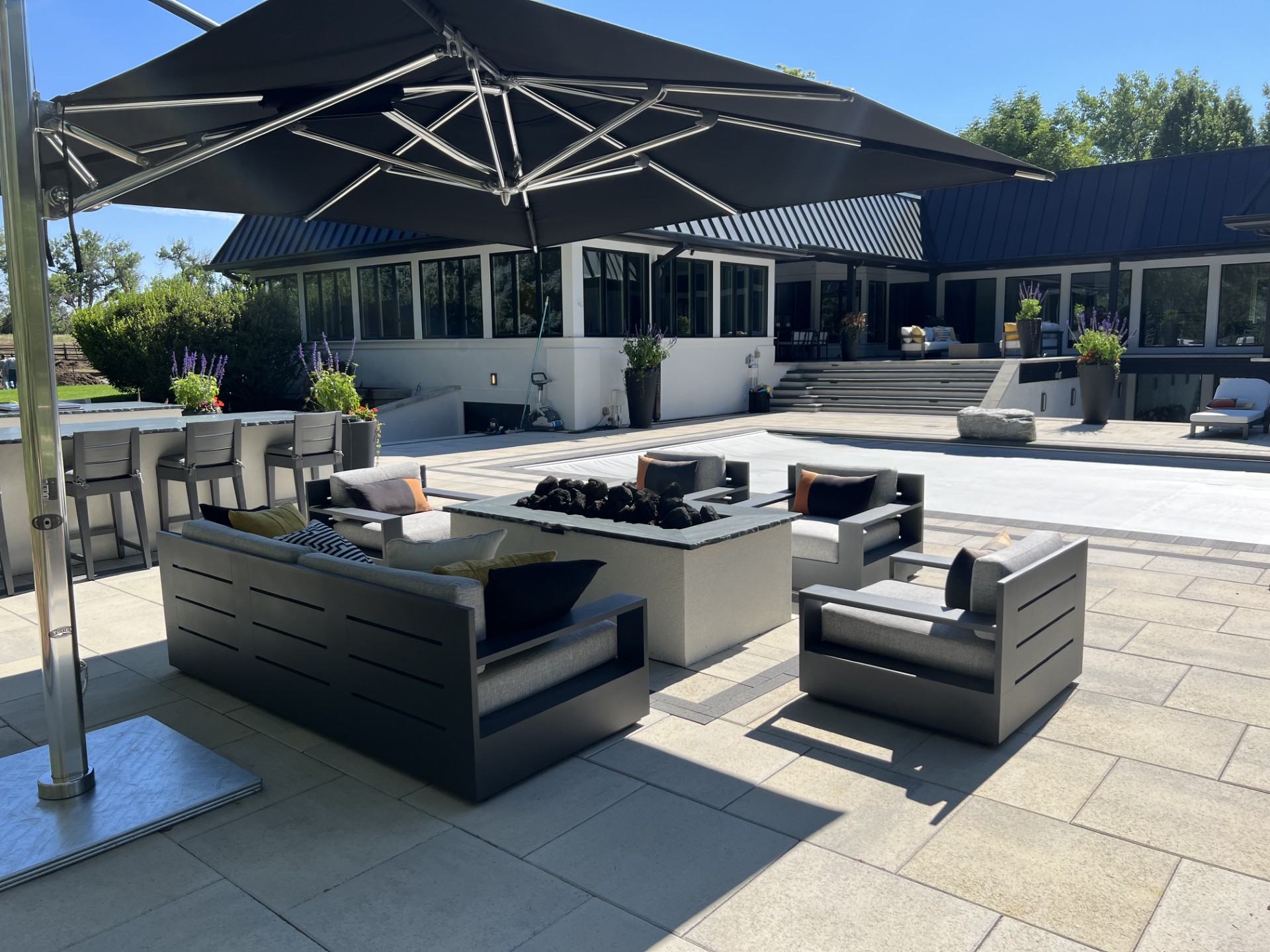 Creating an Outdoor Living Oasis: Fire Pit Design Ideas - Outdoor Living article about Transform your backyard into a cozy gathering space with a custom fire pit. Expl