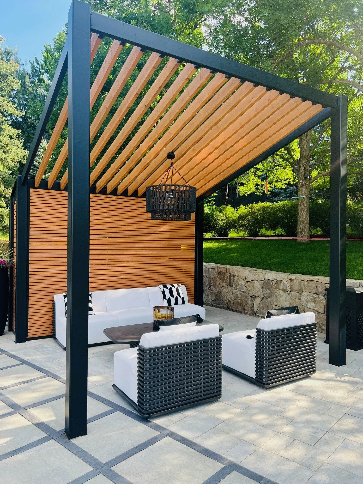 Weston designer reviewing roof coverage and furniture layout before choosing a Denver pergola, pavilion, or gazebo