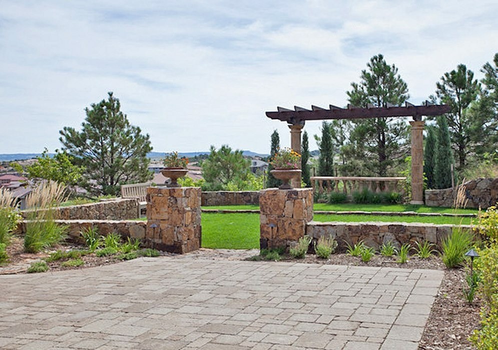 Patio with pavers, columns, and pergola