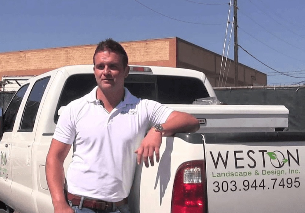 Tyler Weston with Weston Landscape & Design truck in early days