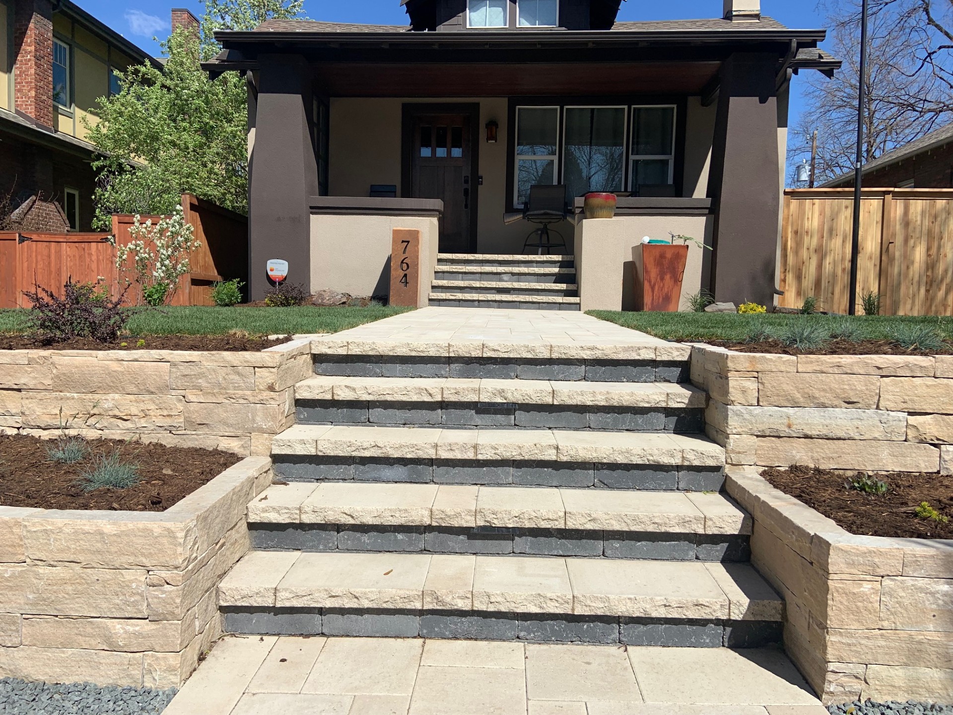 Stone steps and retaining wall with professional landscaping